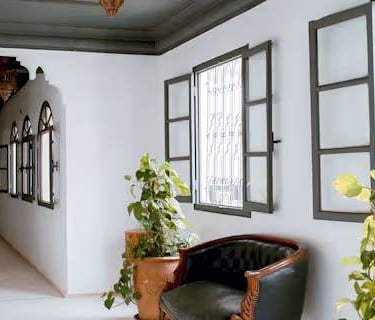 room with many windows and a traditional design.