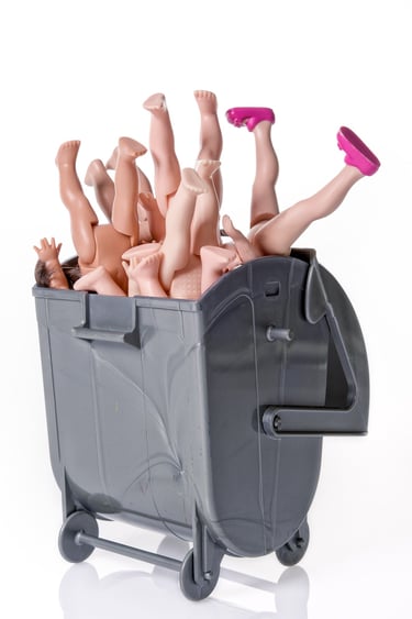 a toy baby doll in a toy box