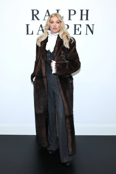 Elsa Hosk wearing a dark fur coat and tailored trousers at the Ralph Lauren New York Fashion Week 2025 show