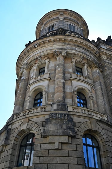 Low angle view of the historic building facade featuring neoclassical architecture.