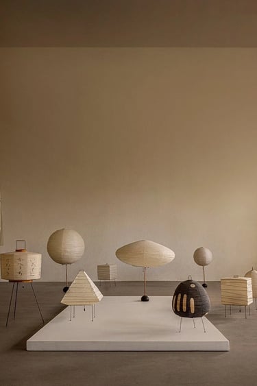 Display of Isamu Noguchi Akari lamps showing soft paper lighting and sculptural forms for calm inter
