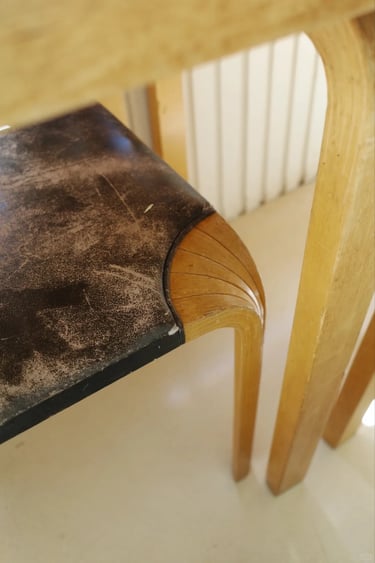 Close-up of bentwood furniture detail showing Alvar Aalto’s warm Nordic modern design