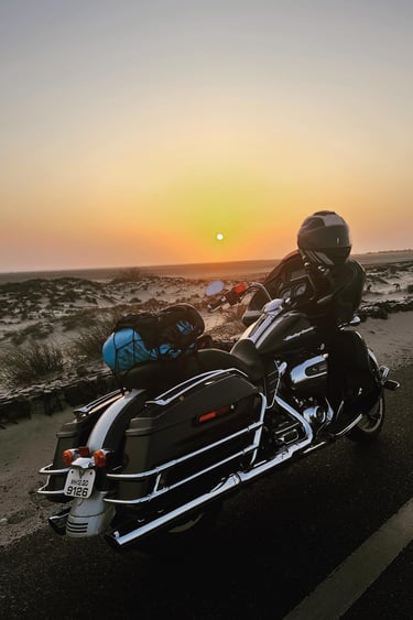a man riding a motorcycle on a road
