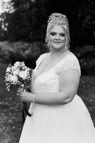 Portrait of a bride with flowers in her hands.