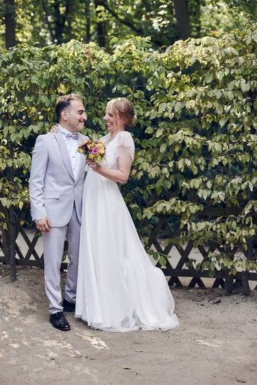 Bride and groom looking at each other smiling.