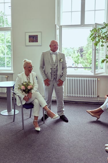 Bride and groom in a waiting room.