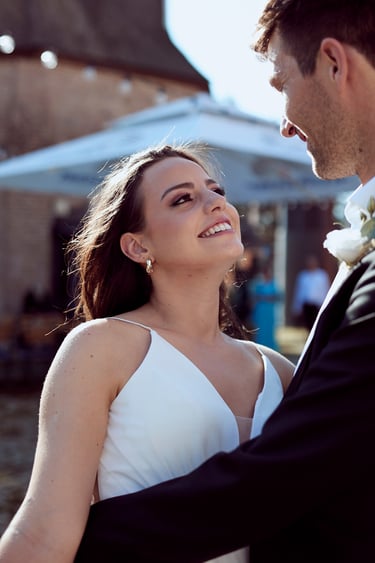 Bride staring into groom's eyes.
