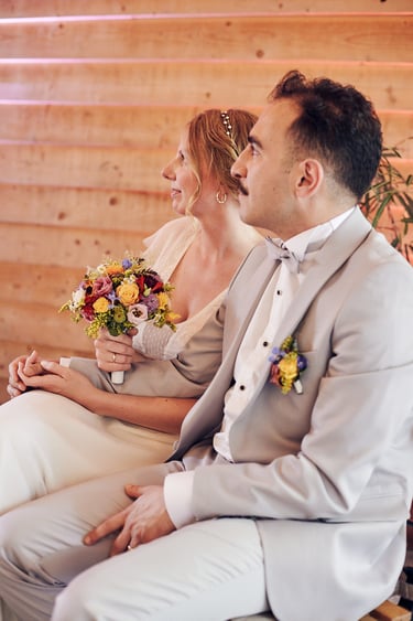 Bride and groom holding hands during the wedding ceremony.