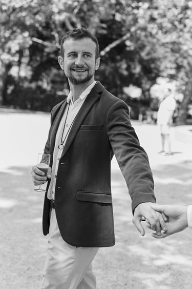 Groom holding hands with his husband.