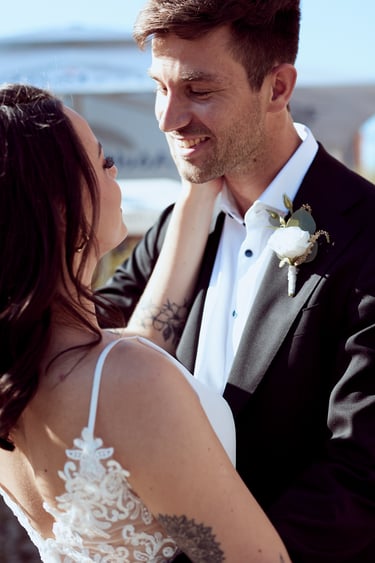 Groom looking at bride.