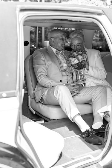 Couple sitting in a limousine.