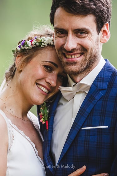 Smiling bride and groom portrait.