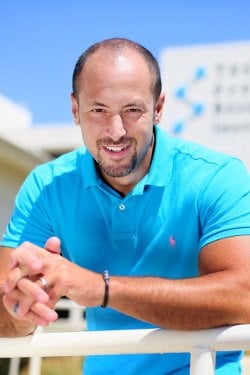 a man in a blue shirt and a white shirt