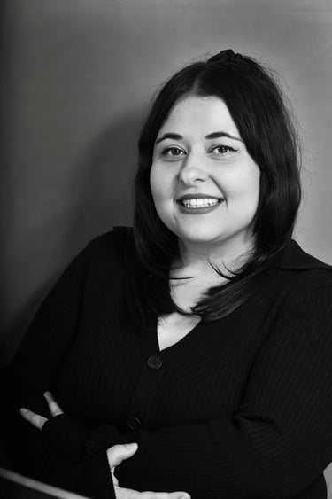 Black and white professional headshot of Emma Santos 