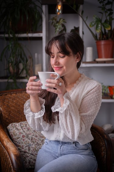 a woman which is happy with her coffee