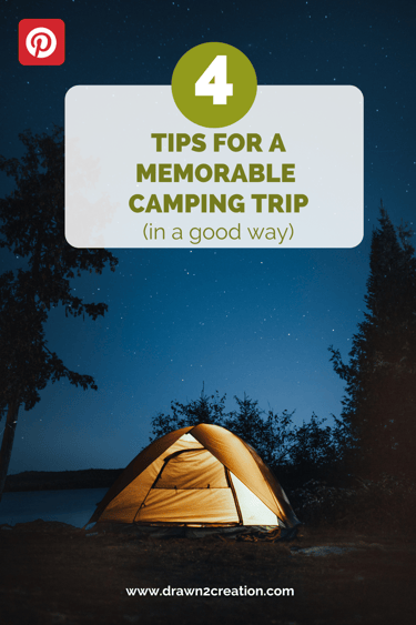 a tent at night with a lake in the background
