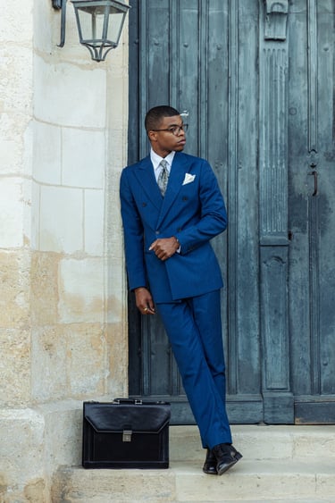 "classic men’s outfit with black briefcase"