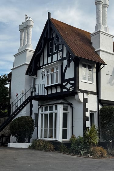 Church house exterior painting in Lancing Sussex, heritage black and white finish