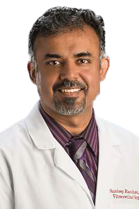 man wearing a white lab coat and button down shirt