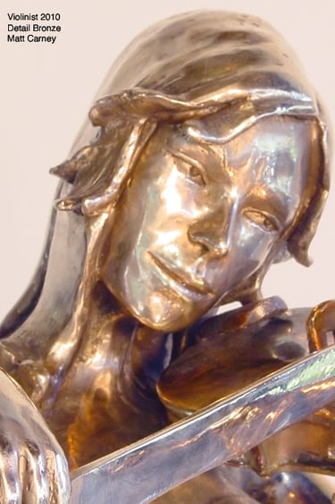 a statue of a woman holding a bow to a violin