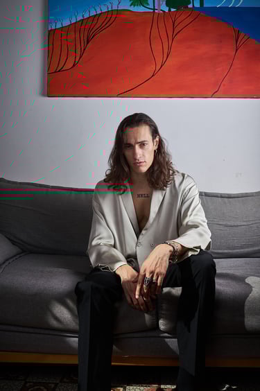 studio photo of a man on a couch