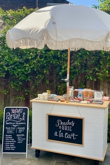 Yogurt parfait bar cart in a backyard