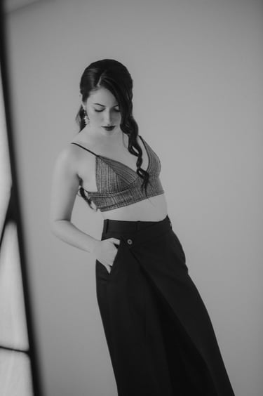 a woman in a bra top and skirted skirt