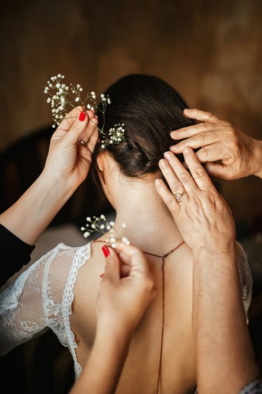 Hair model in bridal updo with veil.