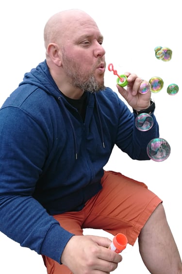 a man blowing bubbles in the air