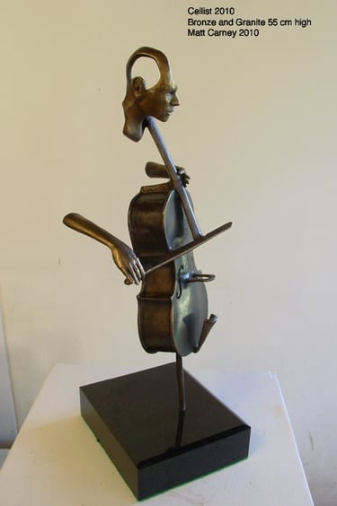 a sculpture of a cello player with an open mind