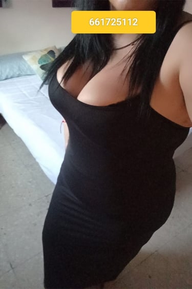a woman in a black dress with a yellow tag on her chest