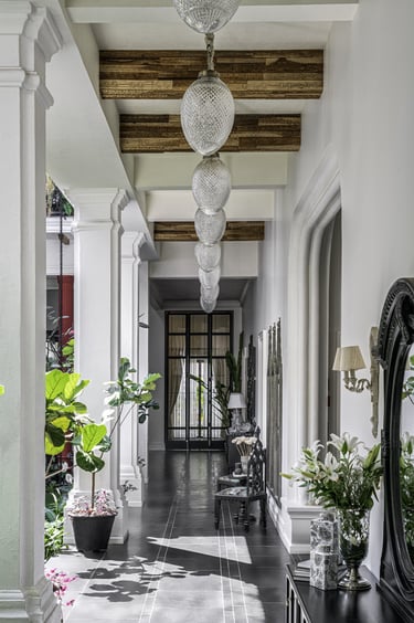 a hallway with a mirror and a mirror