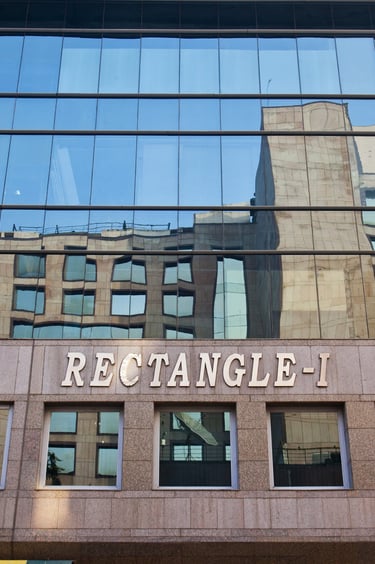 a building with a sign that says rectangle-1