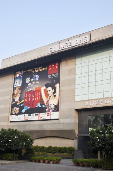 a building with a large poster on the side of it which says square one
