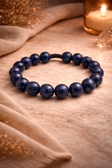 8mm lapis lazuli bracelet deep blue natural stone with gold flecks on marble warm light