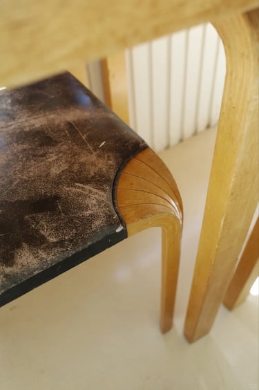 Close-up of bentwood furniture detail showing Alvar Aalto’s warm Nordic modern design