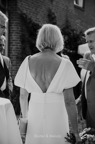 Bride's dress cut out in the back.