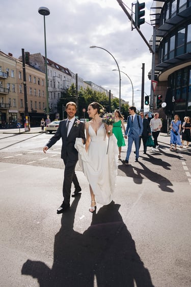 Bride and groom walking in Mitte, Berlin.