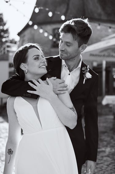 Black and white portrait of a newlywed couple.