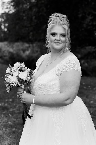 Portrait of a bride with flowers in her hands.