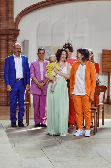 A gay couple with their entourage in a church.