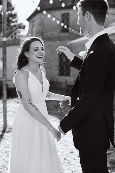 Bride laughing with groom.