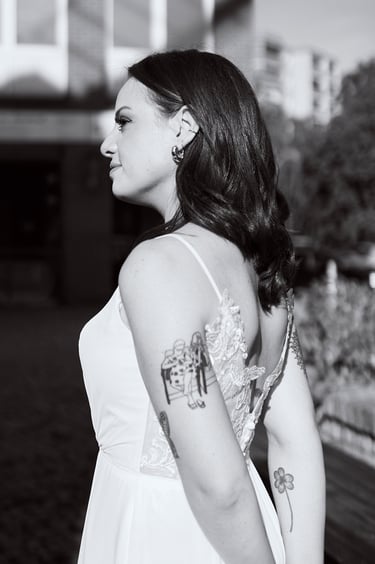 Bride with tattoos in profile.