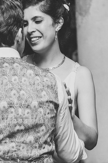Bride smiling at the groom during the first dance.