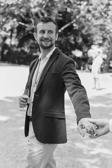 Groom holding hands with his husband.