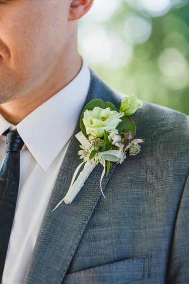 Close-up of a groom's corsage.