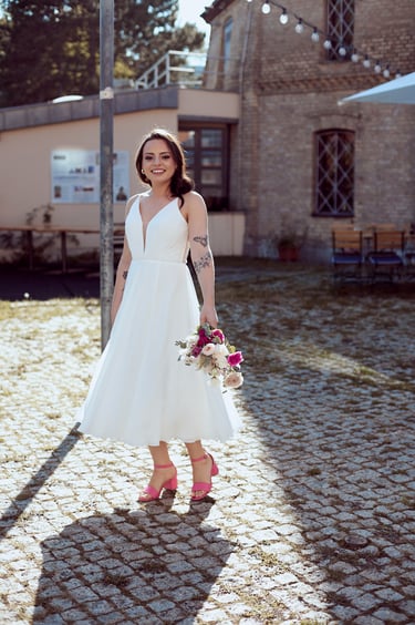 A happy bride twirling.
