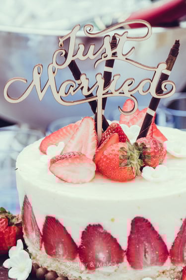 Wedding cake with a "Just Married" topper.