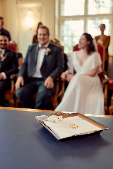 Wedding rings on a pillow at a wedding ceremony.