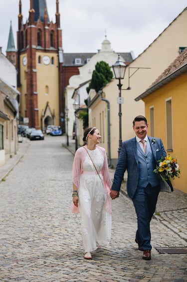 Newlyweds walking in an old town of Werder.